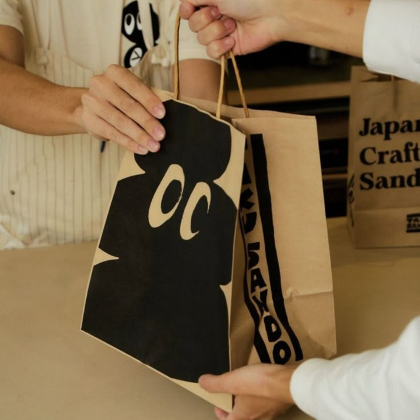 Eco-friendly kraft paper custom takeout bag with printed logo for restaurants.