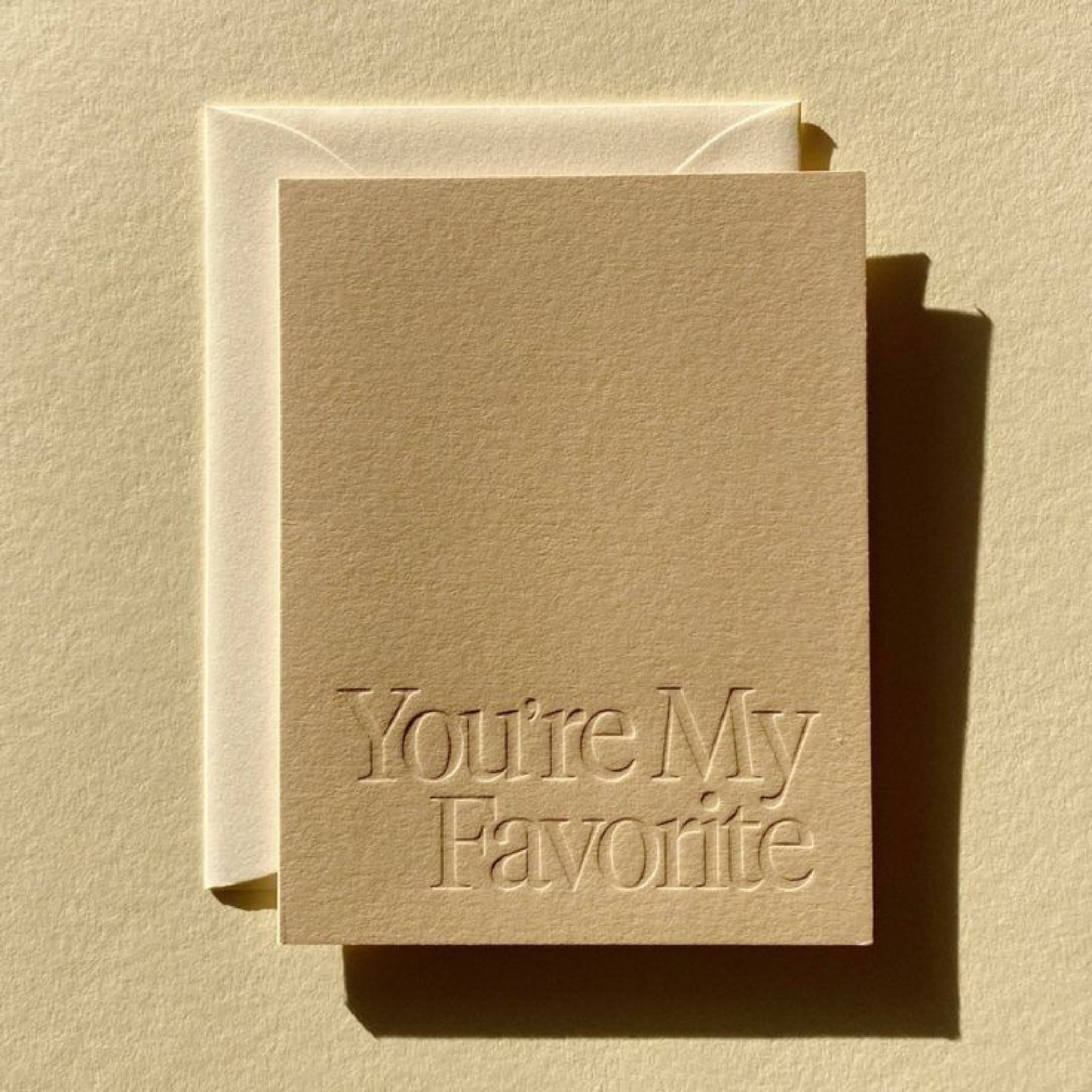 Custom paper packaging with debossed logo for a sophisticated, textured finish.