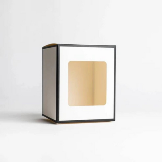 Retail-ready candle box with die-cut window and brand print