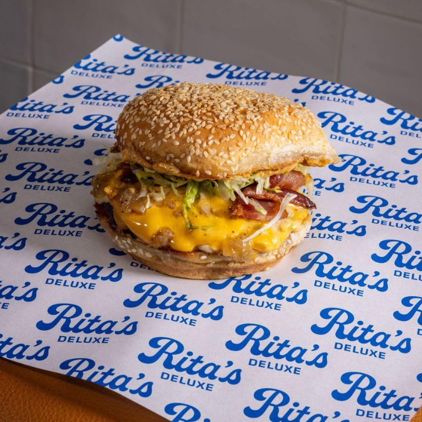 Branded burger paper used for food trucks and takeaway packaging with custom logo print.