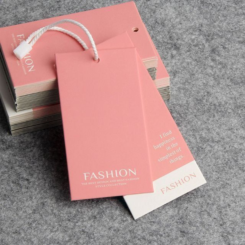 Custom branded folded hang tags for apparel, fashion, and boutique packaging.