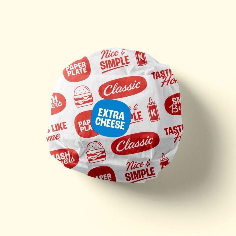 Custom printed burger paper with logo for branded food wrapping in restaurants and takeaway.