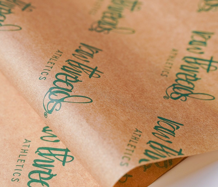 Custom kraft tissue paper design support for branding and packaging artwork.