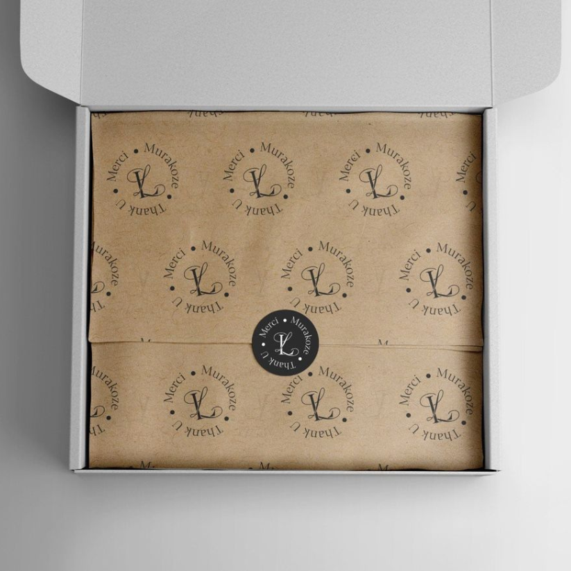Custom kraft tissue paper with branded logo for premium packaging and unboxing.