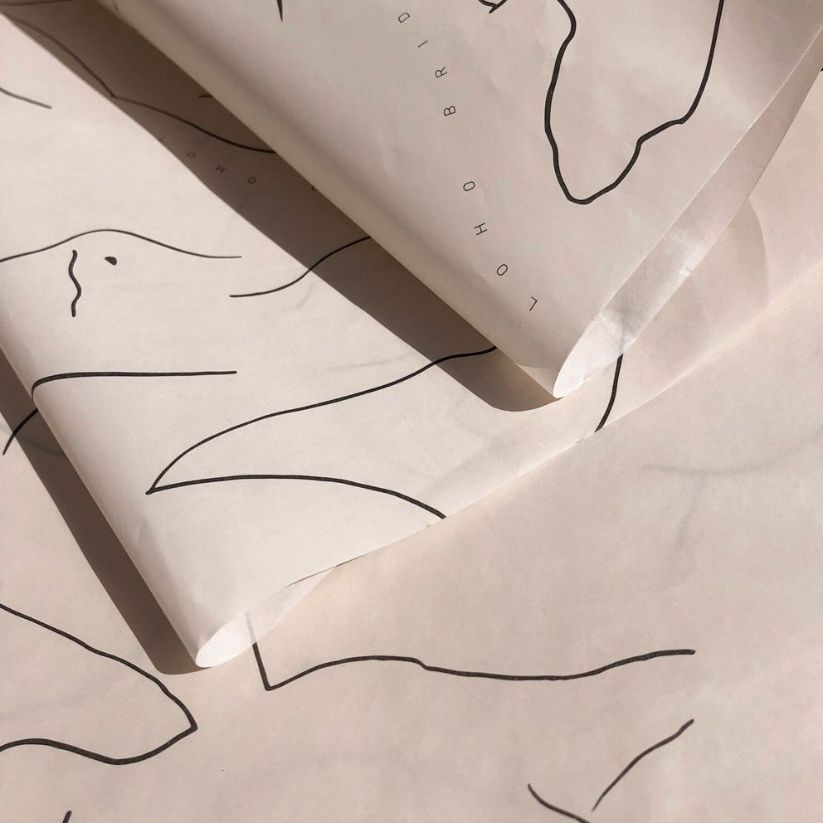 Premium custom tissue paper with custom printing for luxury product packaging.